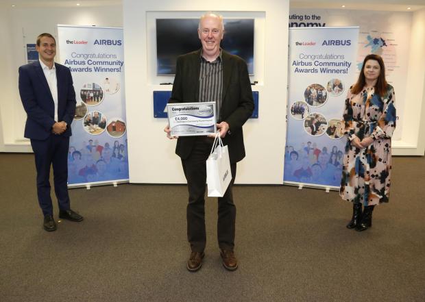 The Leader: Airbus' Paul Kilmister and The Leader editor Susan Perry pictured with Councillor Anthony Wilcox of Huntington Parish Council, which was awarded £4,000.