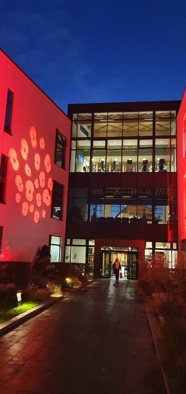 The Moneypenny building coloured red for Remembrance.