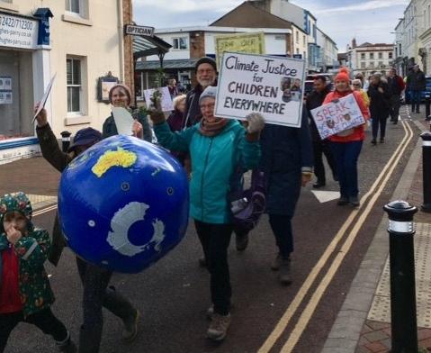 Protestors marched through Holywell demanding climate justice.