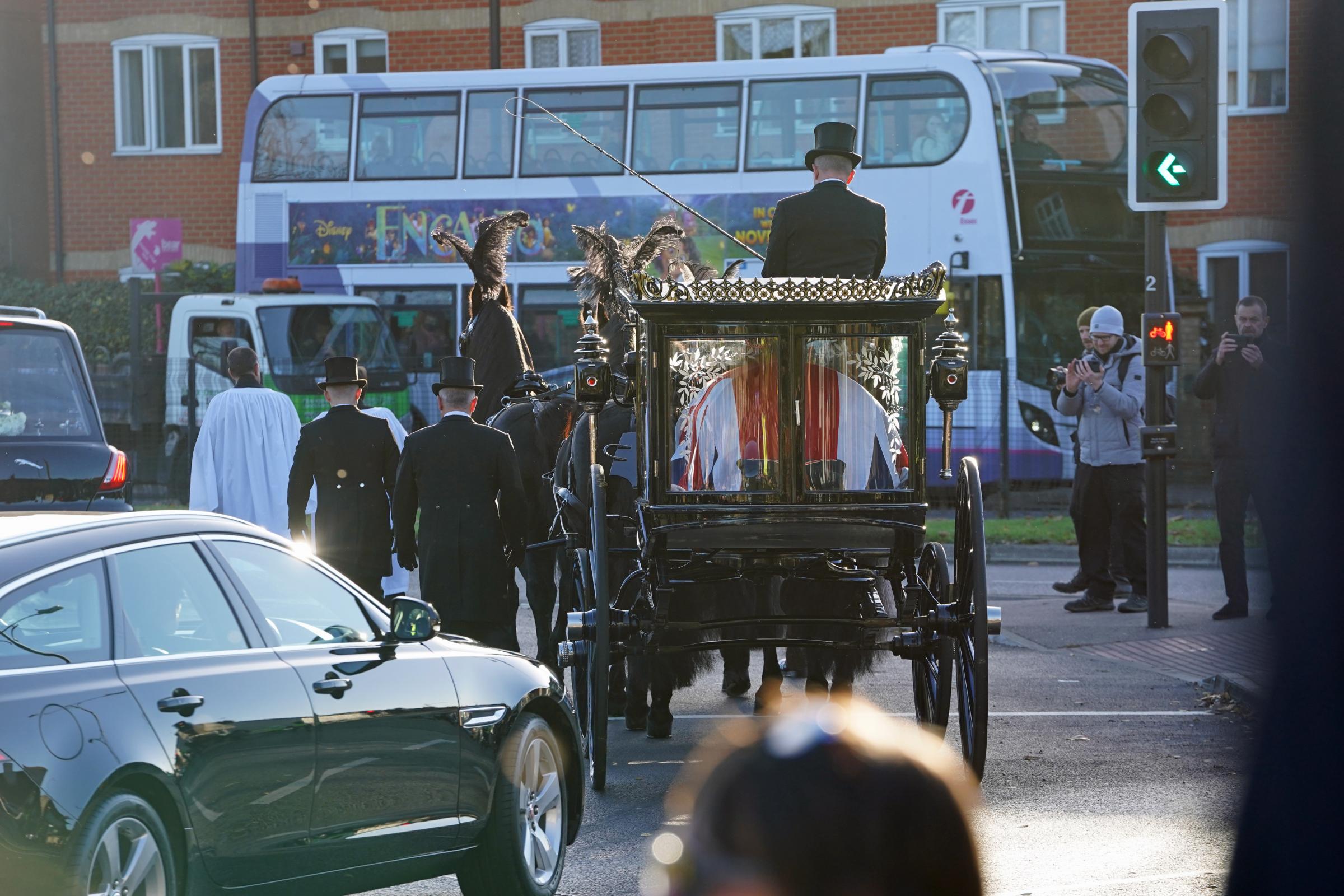 The horse drawn funeral hearse carrying the coffin of Sir David Amess leaves St Marys Church in Prittlewell, Southend following his funeral service. Picture date: Monday November 22, 2021.