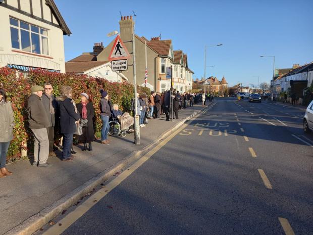 People lines the streets in Southend ahead of the procession