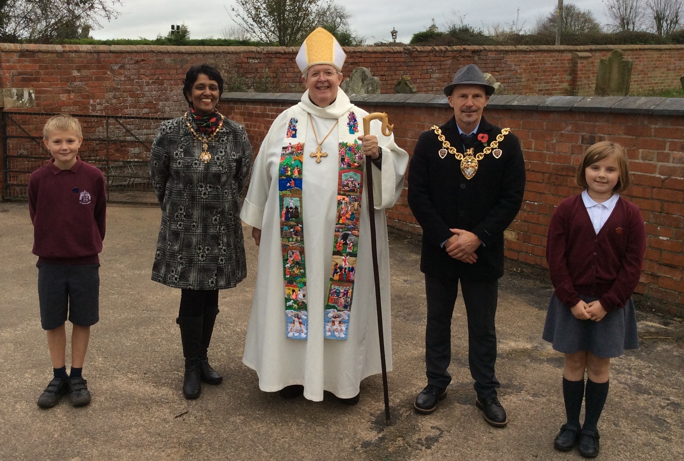 Rt Revd Gregory Cameron, Bishop of St Asaph, with the Mayor and Mayoress Cllr Ronnie Prince and Sunanda Kapas, Head Boy William Johnson and Head Girl Ada Bebbington.