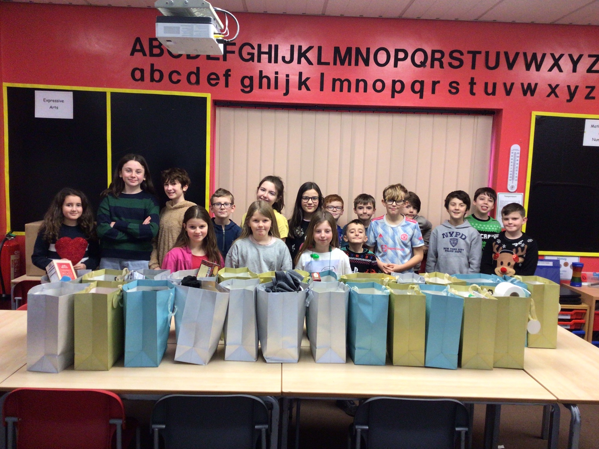 Ysgol Parc Y Llan pupils with the gift bags they have prepared for the homeless.