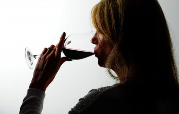 The Leader: A woman drinking red wine. Credit: PA