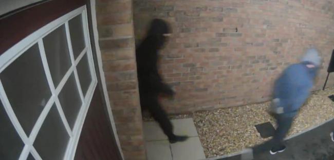 The men were captured on the home's CCTV camera.
