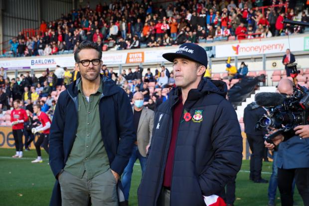 The Leader: Ryan Reynolds and Rob McElhenney at theire first Wrexham home match. Picture Wrexham AFC