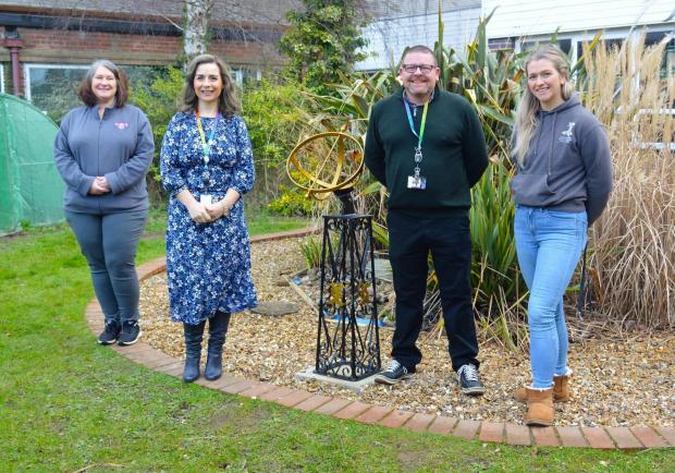 The Leader: Keep Wales Tidy Flintshire Project Officer Wendy Jones with staff and students in the new gardens and 'wildlife corridor' created by members of the Construction Trainee Academy and Traineeship learners