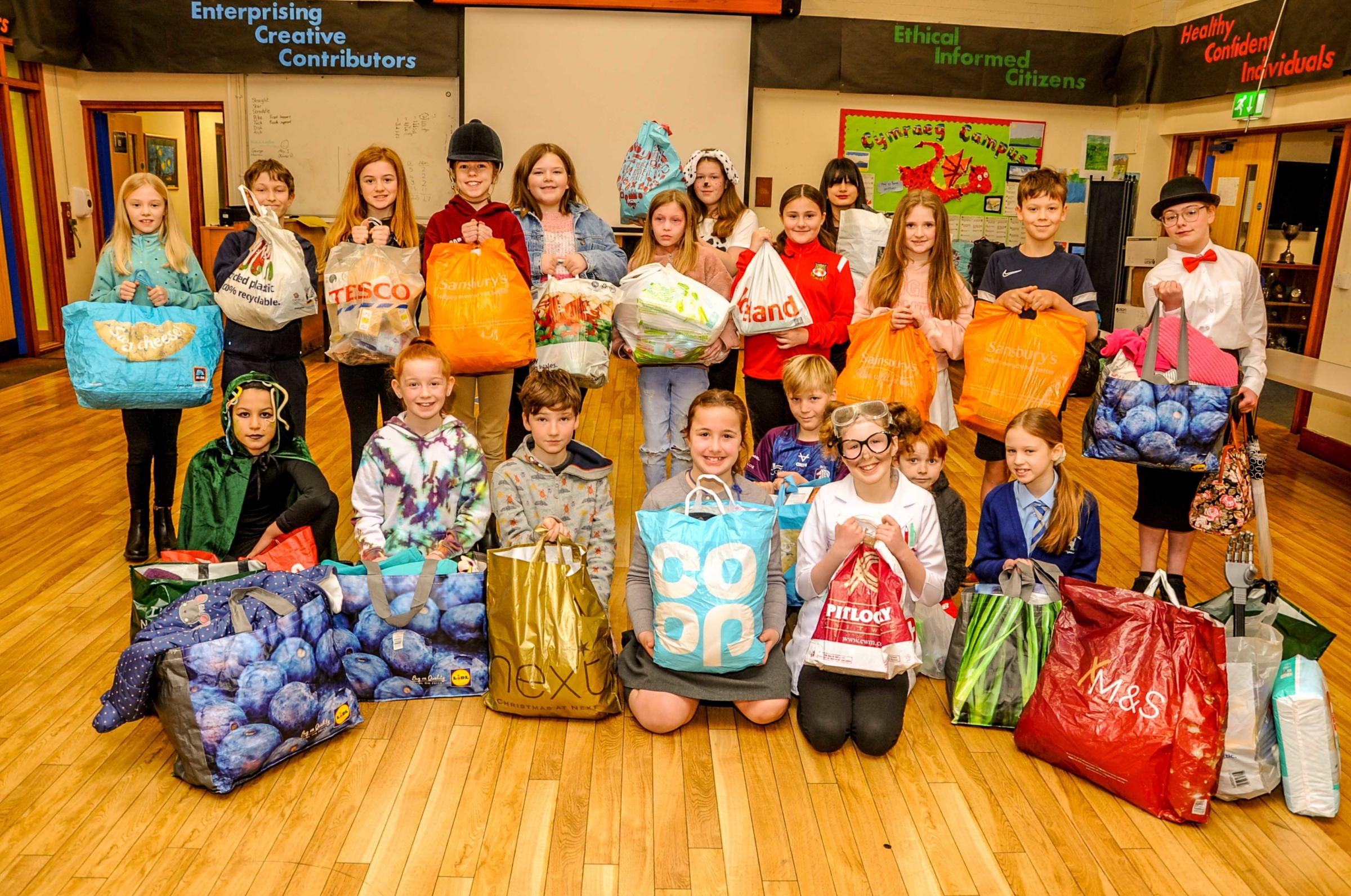 Pupils at the Rofft School, in Marford, with donations made to help Ukranian families.