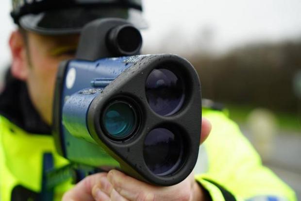 The Leader: A police officer with a speed camera