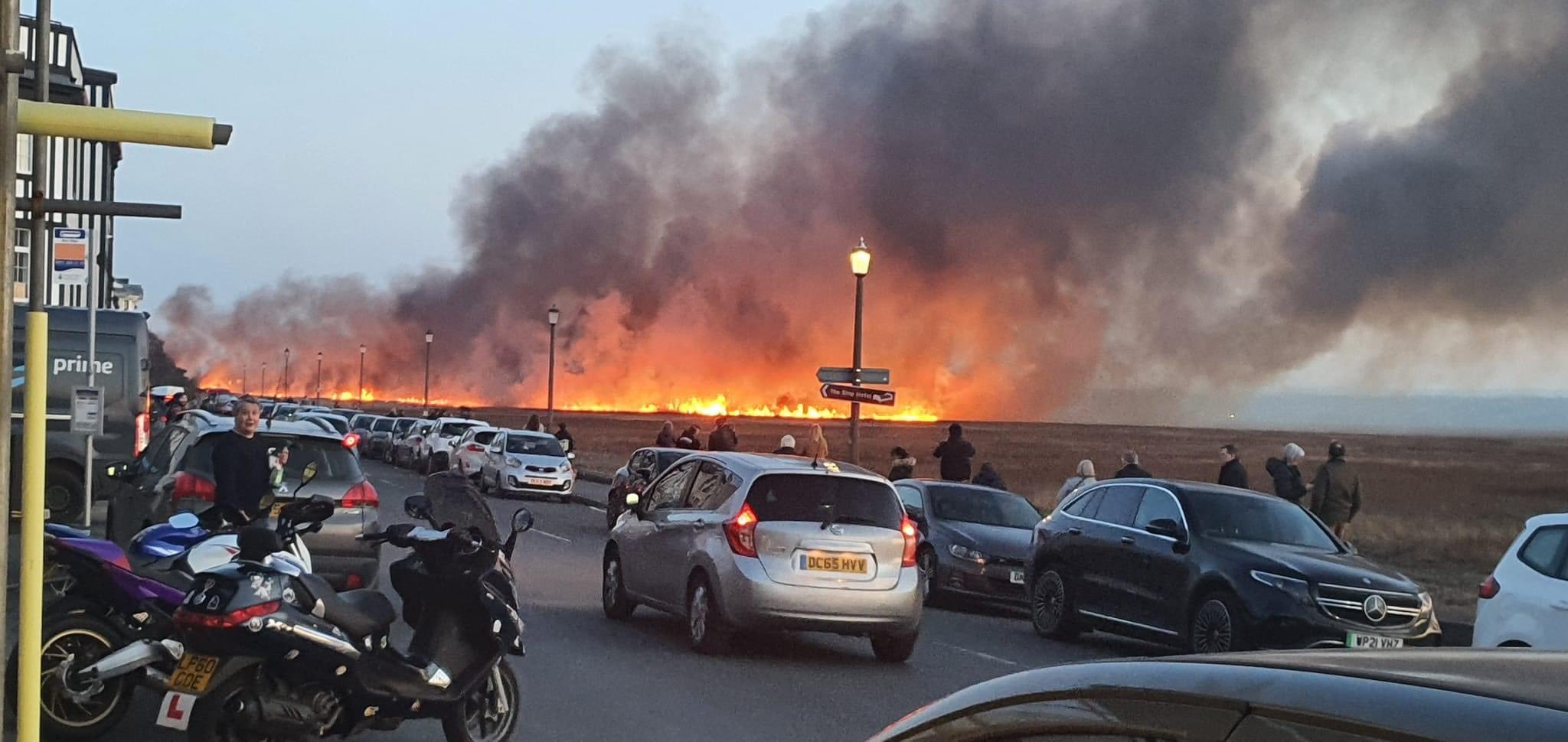 A wildfire takes hold on marshland close to Parkgate (pic: @DaviesKatie)