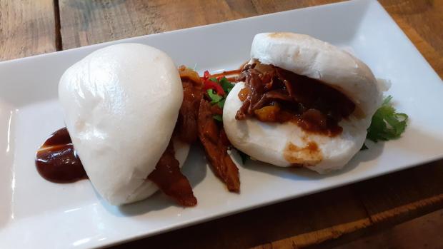 The Leader: Steamed bao buns with hoisin glazed duck and seasme seeds