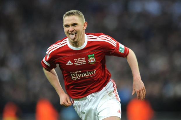 Wrexham's Johnny Hunt celebrates scoring the winning penalty in the shoot out as his side win the FA Carlsberg Trophy Final at Wembley Stadium, London. PRESS ASSOCIATION Photo. Picture date: Sunday March 24, 2013. See PA story SOCCER Trophy. Photo