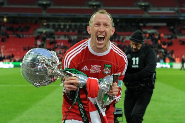 Wrexham's player manager Andy Morrell celebrates with the trophy after his side win the FA Carlsberg Trophy Final at Wembley Stadium, London. PRESS ASSOCIATION Photo. Picture date: Sunday March 24, 2013. See PA story SOCCER Trophy. Photo credit