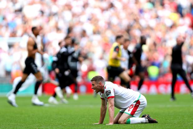 Wrexham's Paul Mullin appears dejected at the end of the Buildbase FA Trophy final at Wembley Stadium, London. Picture date: Sunday May 22, 2022.