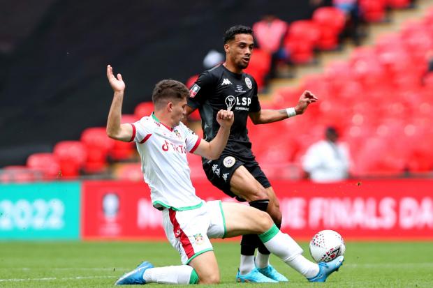Wrexham's Jordan Davies (left) tackles Bromley's Corey Whitely during the Buildbase FA Trophy final at Wembley Stadium, London. Picture date: Sunday May 22, 2022.