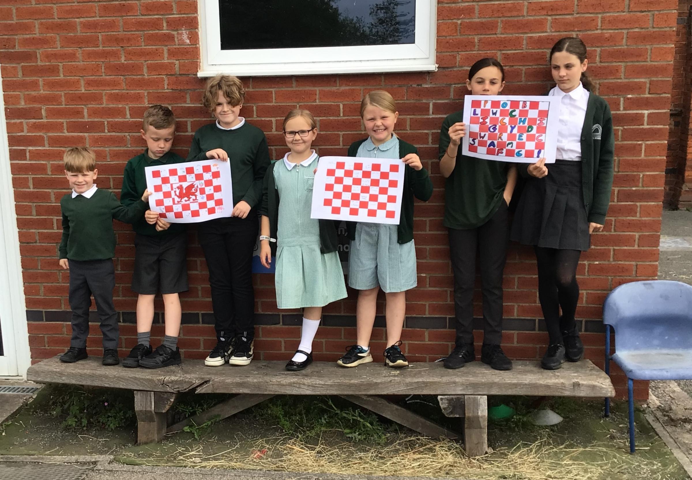 Pupils at Eyton Primary School with some of their good luck flags for Wrexham AFC.