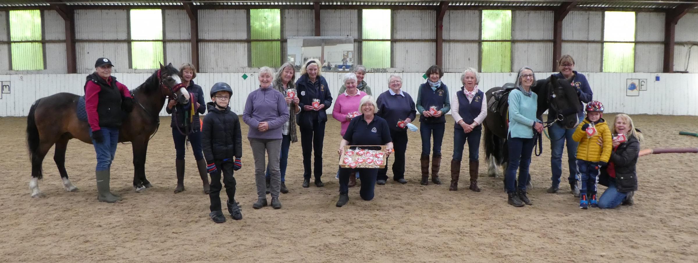 Some of the Clwyd Special Riding Centre volunteers receiving their thank you biscuits during Volunteers Week.