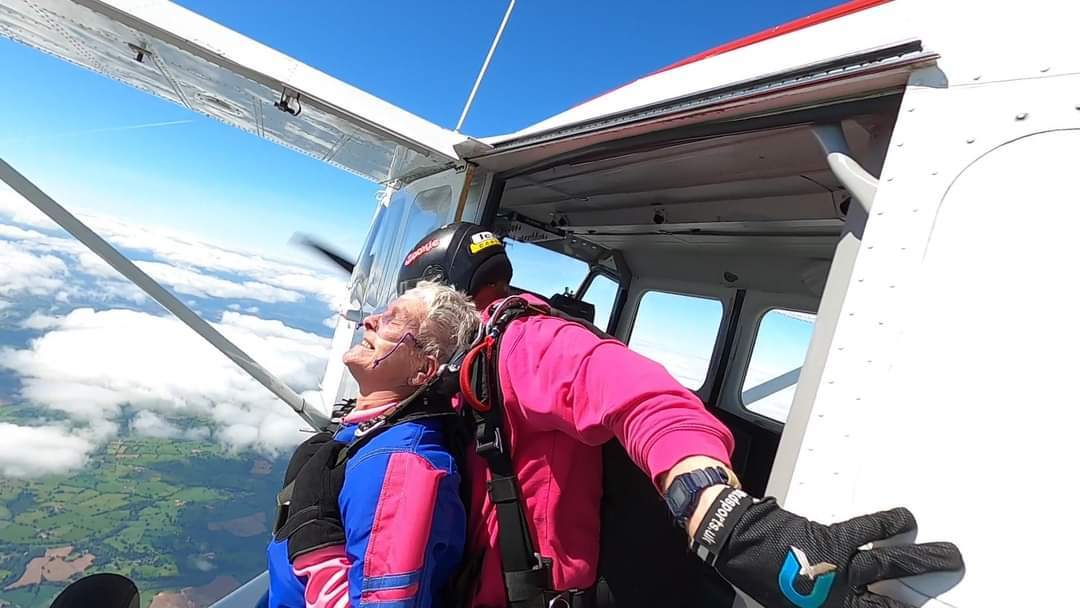 Making the leap from the plane is fundraiser Julie Le Dain.