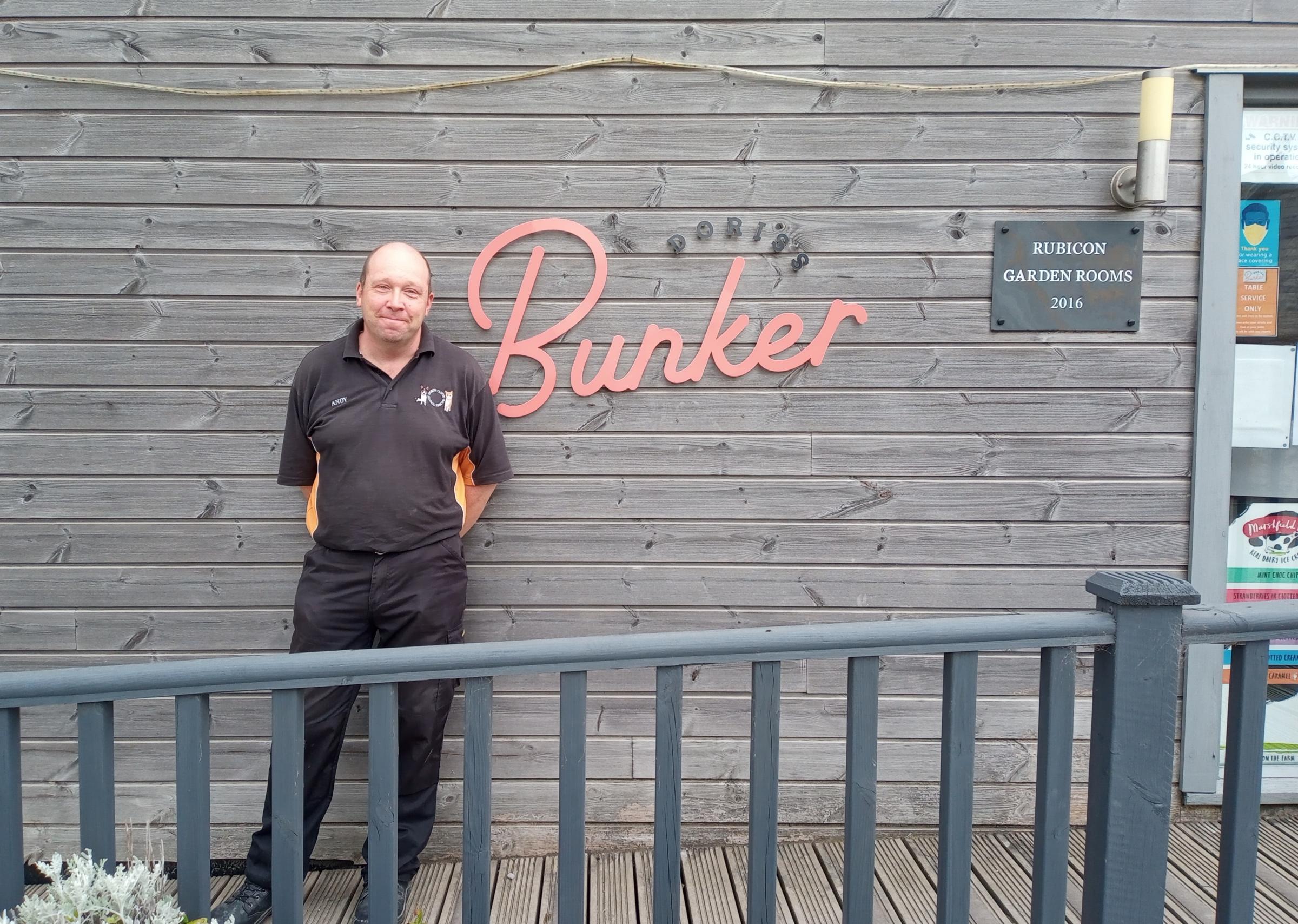 NCAR Kennels, IT and Reception staff member Andy Horton outside the welcoming Doriss Bunker cafe at the Trelogan charity site.