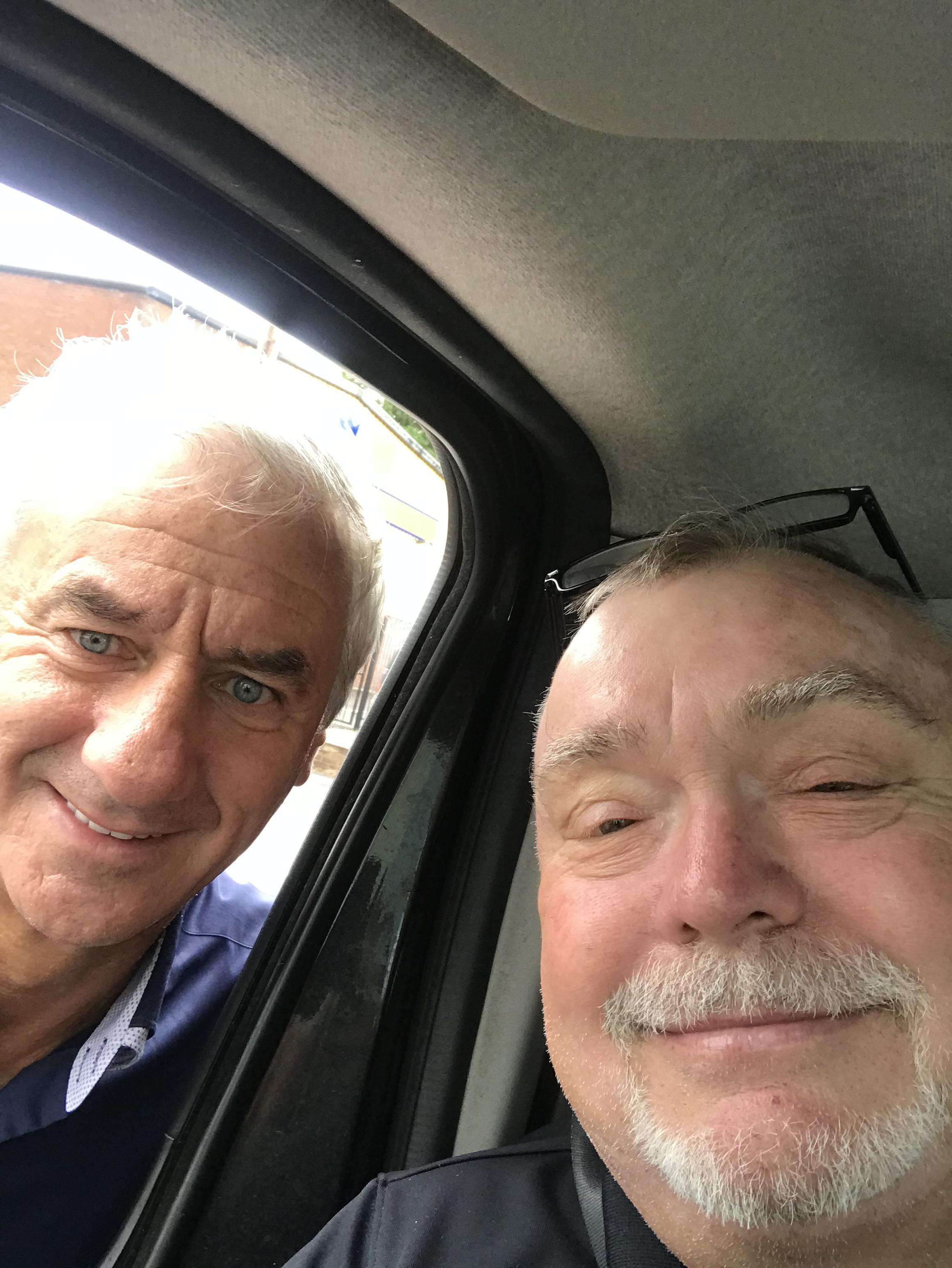 Jez Mays with football legend Ian Rush, in his taxi.