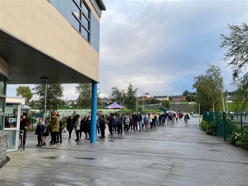 More than 300 people queue to attend the open evening.