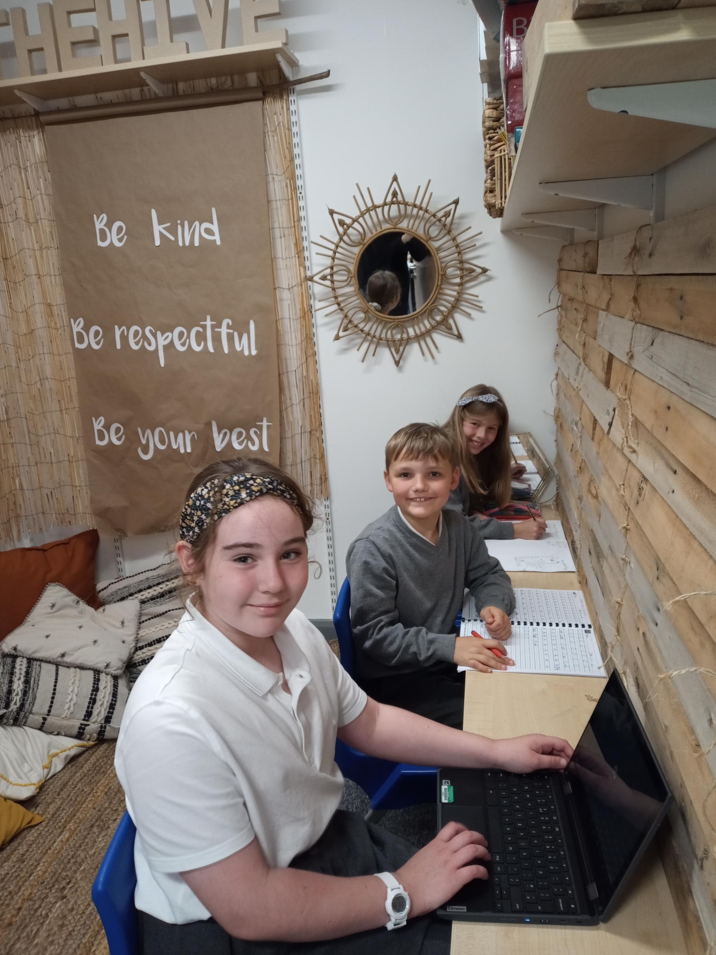 In their classroom Hive at Borras Park Primary School, are Erin Jones, Ethan Kopczyk and Lottie Richardson.