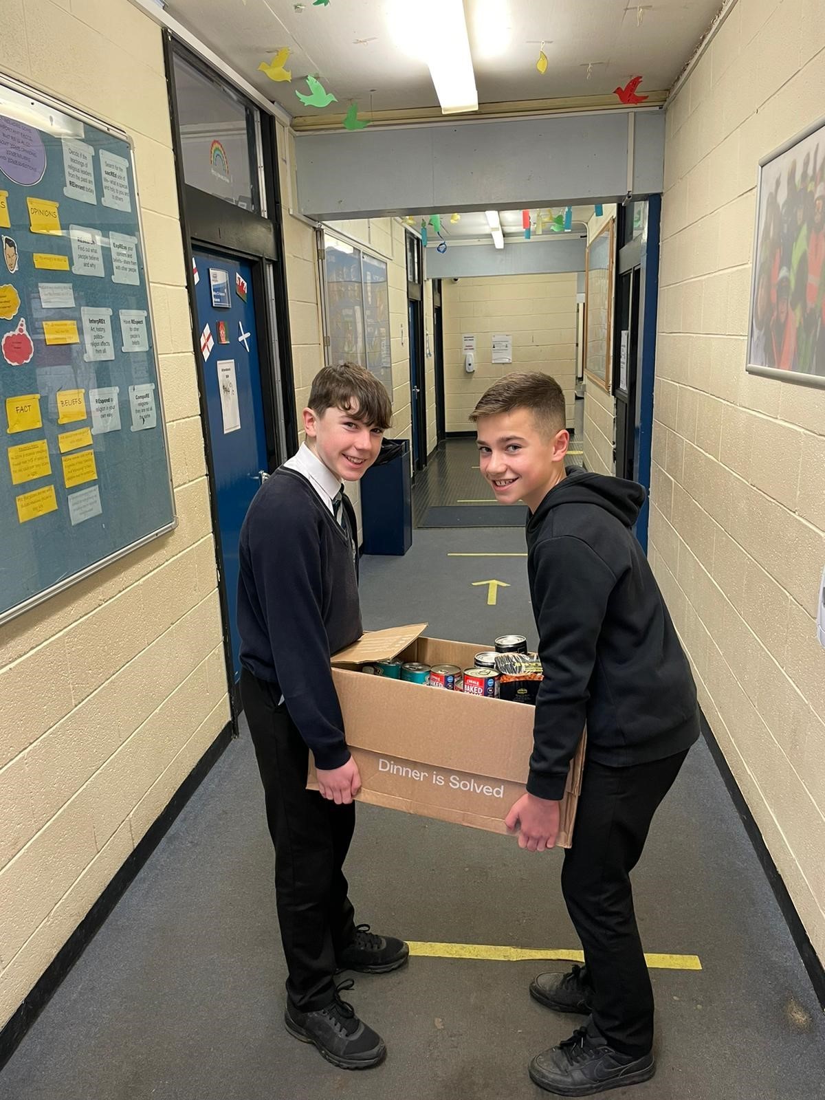 On collection day, Ben Charnley and Tom Wright help get the donated items ready to be loaded onto the Foodbank van.