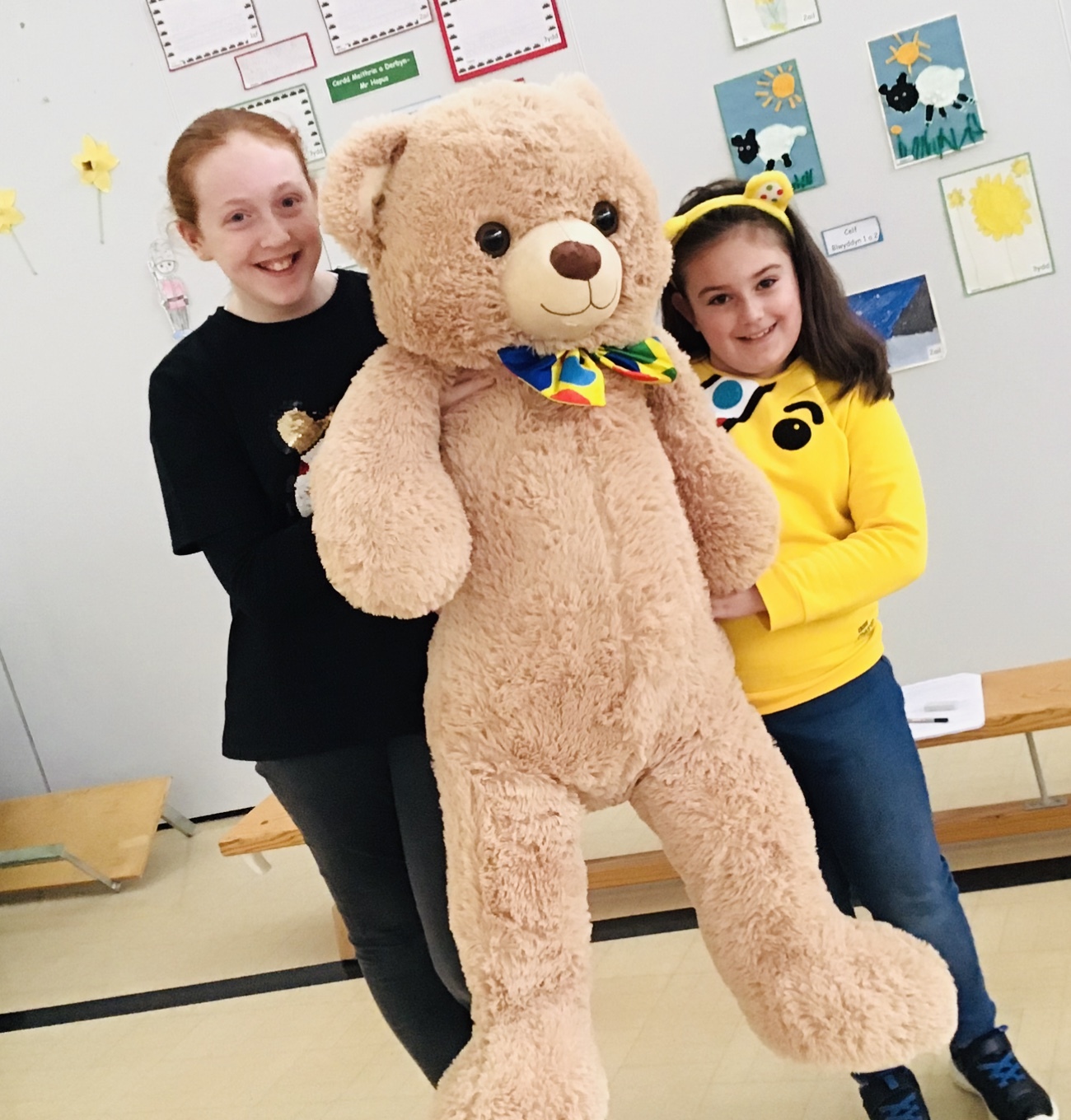 Ava and Holly with the teddy bear raffled at Ysgol Ty Ffynnon for Children in Need.