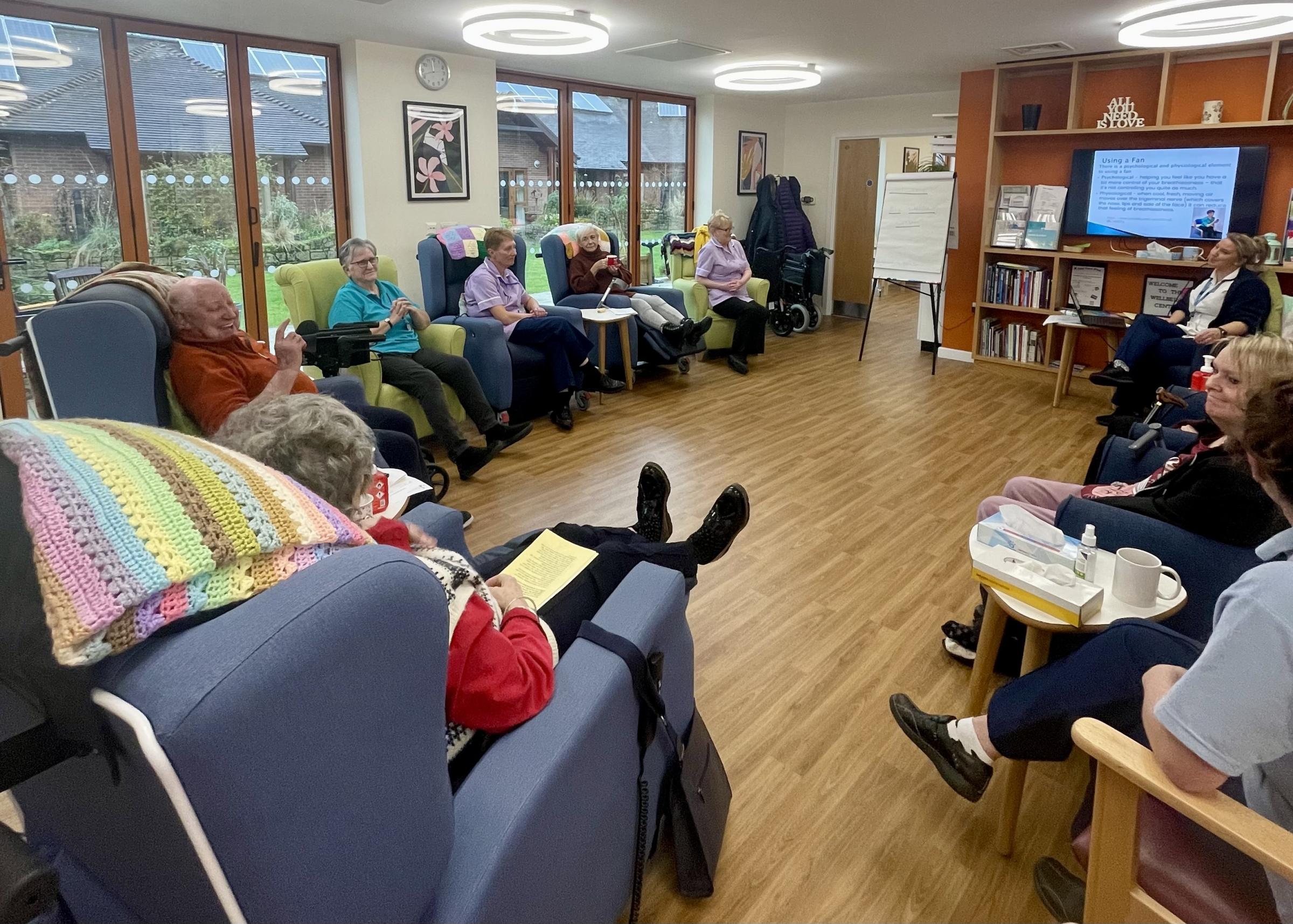 Patients in a session learning techniques to tackle their breathlessness.