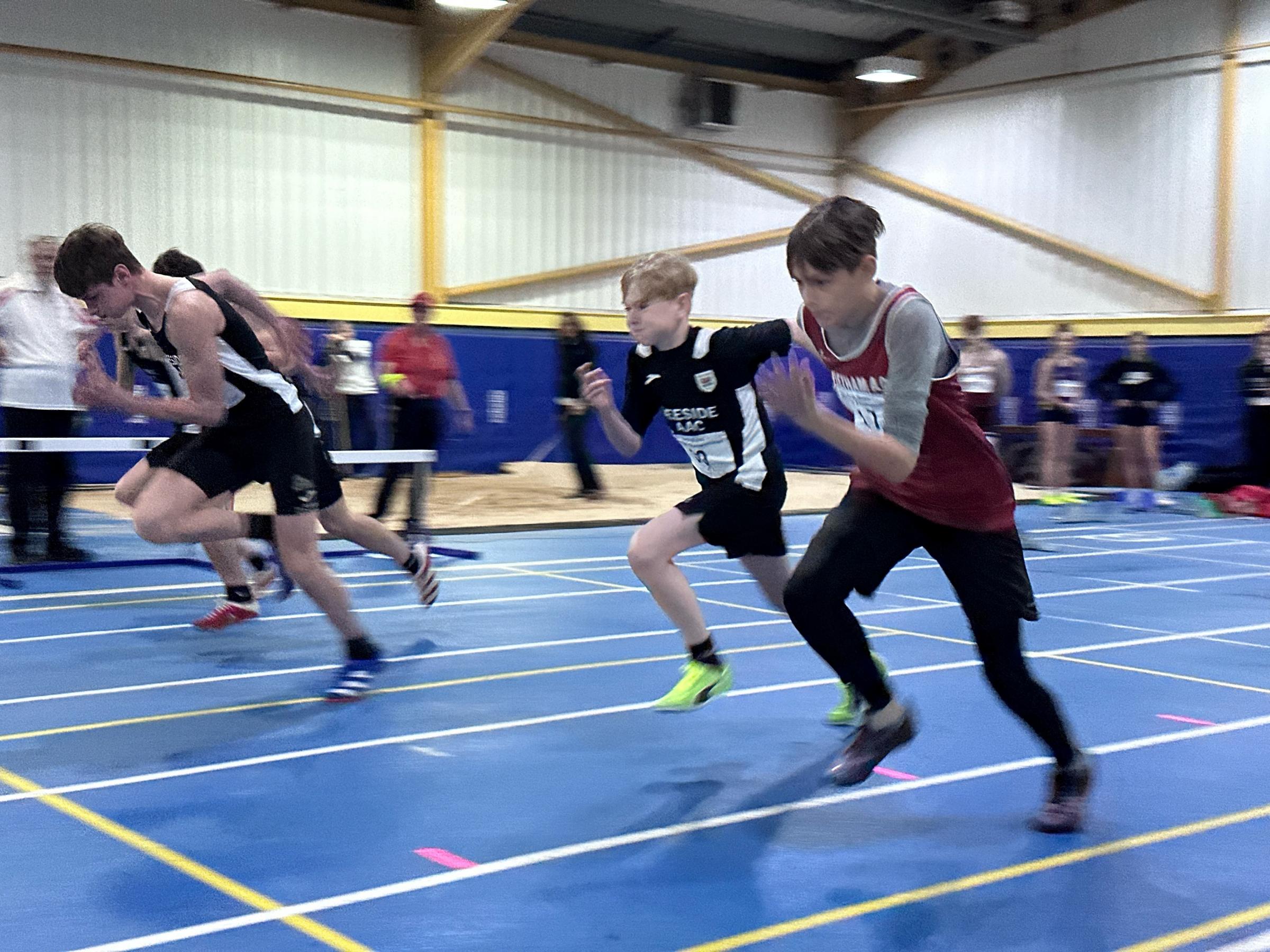 Evan McGlynn (right) competing in the North Wales Indoor athletics competition.
