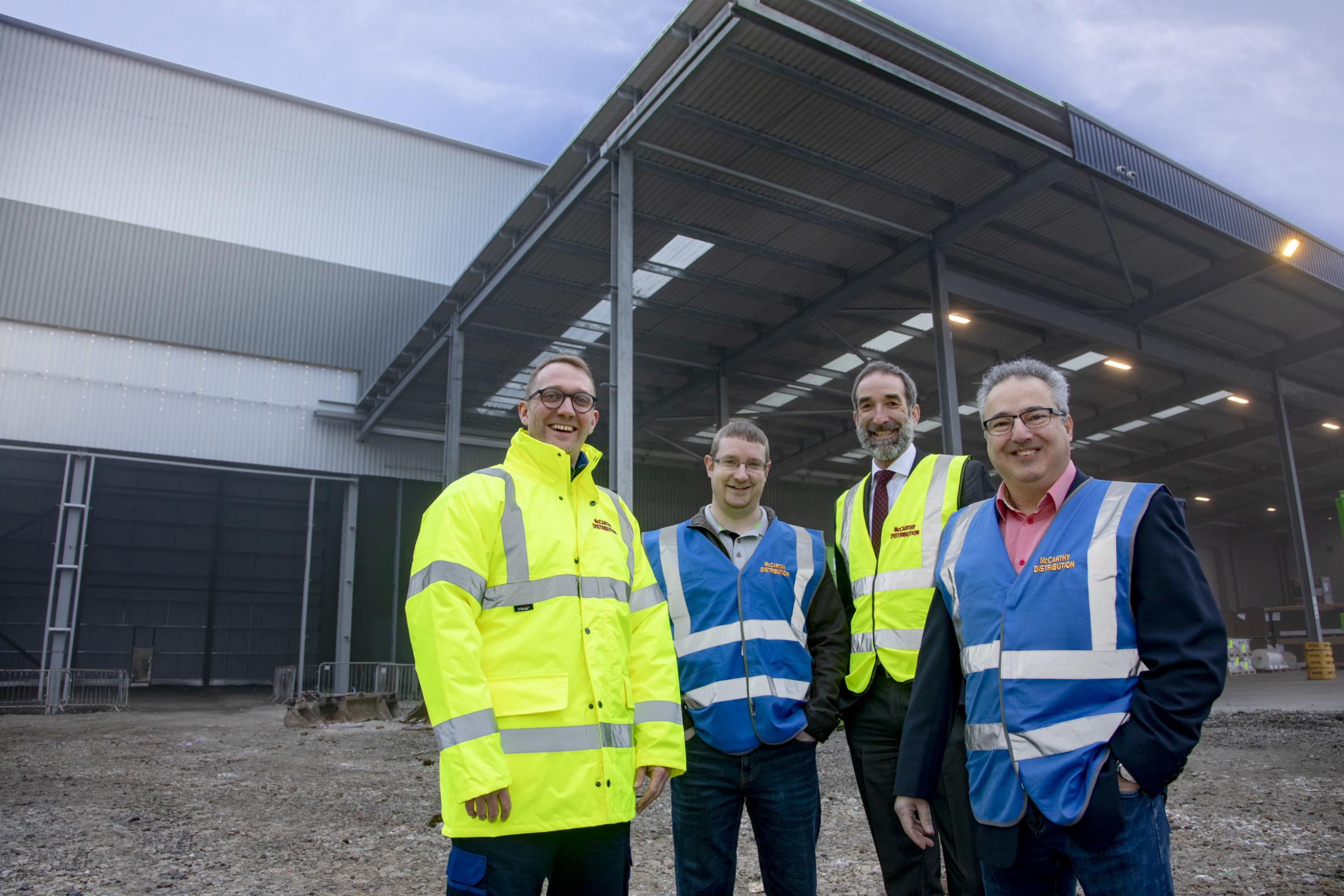 Steve Jones, McCarthy Distribution warehouse manager; Tom Davies, warehouse manager, Wipak; Mike McCarthy, McCarthy group’s managing director and Peter Stavrou, Wipak Group, logistics manager. Photo: Mandy Jones