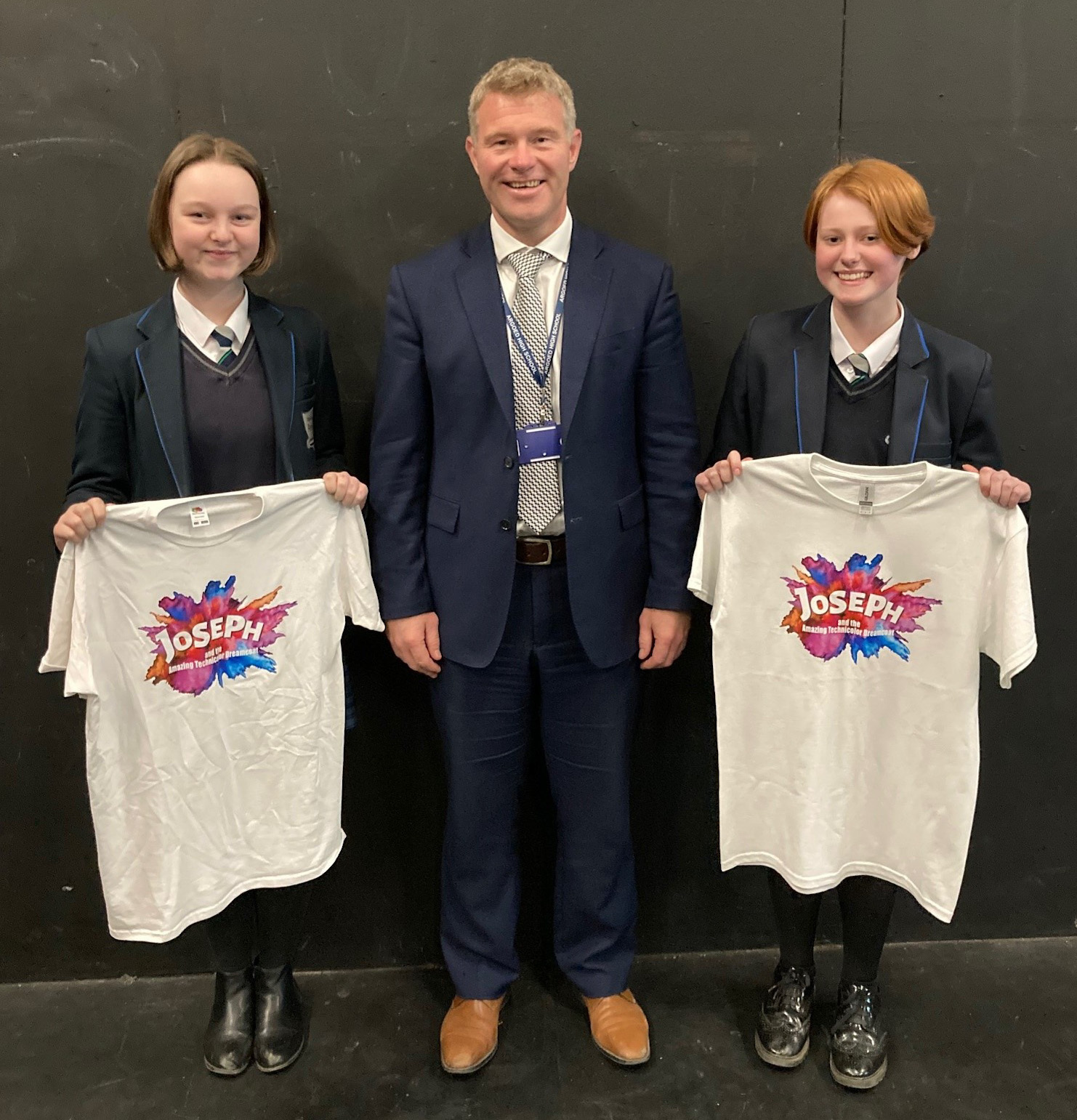 Niamh Howes-Patterson and Emily Baines are congratulated by their headteacher, Paul Smith, after their performance in Joseph and the Amazing Technicolour Dreamcoat.
