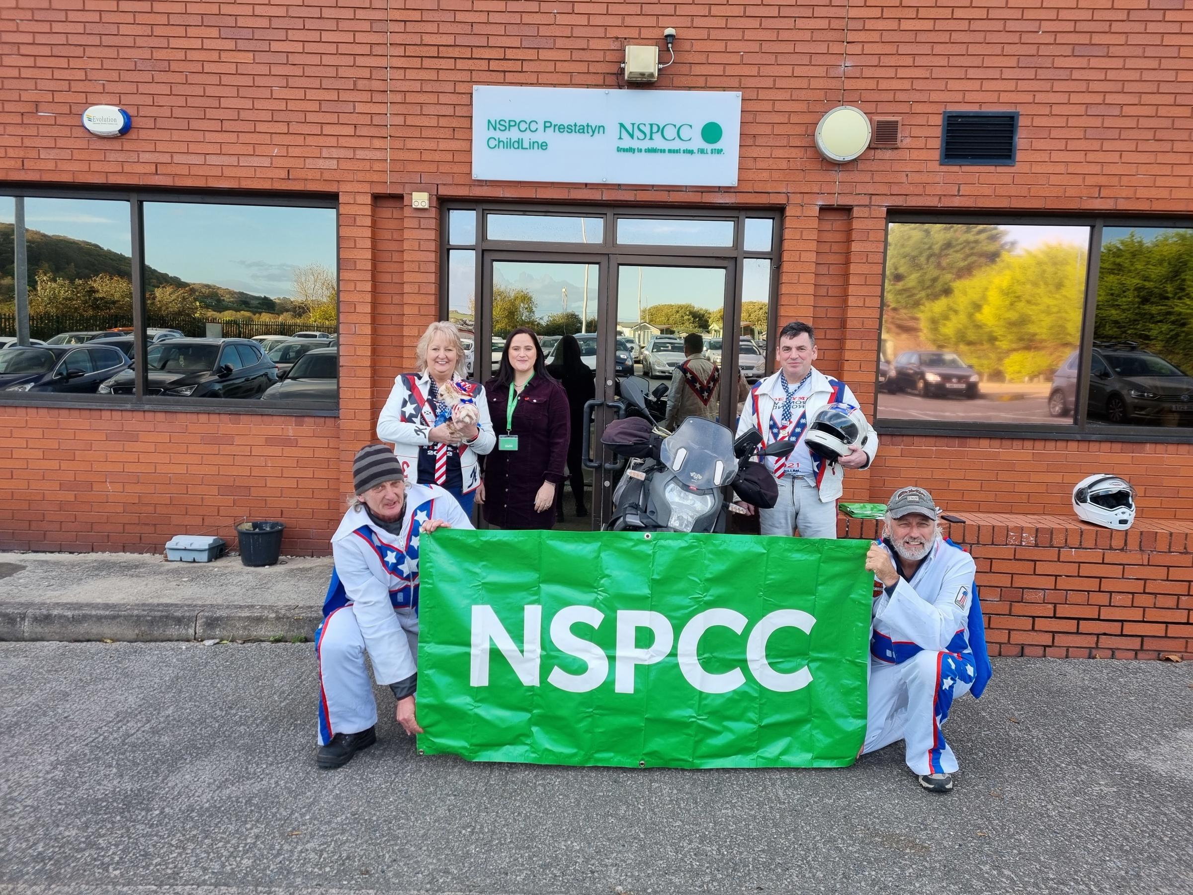 Members of the Cymru Knievels with Jessica Finnegan (third from left) at the NSPCCs Childline Prestatyn base. 