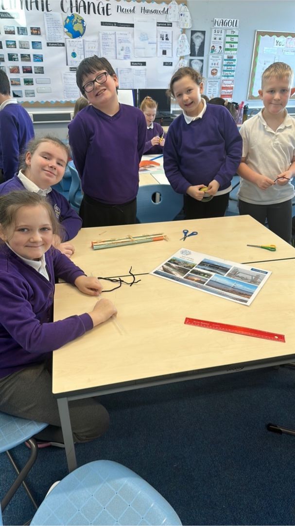 Pupils work in groups on their challenge to design and build a bridge.
