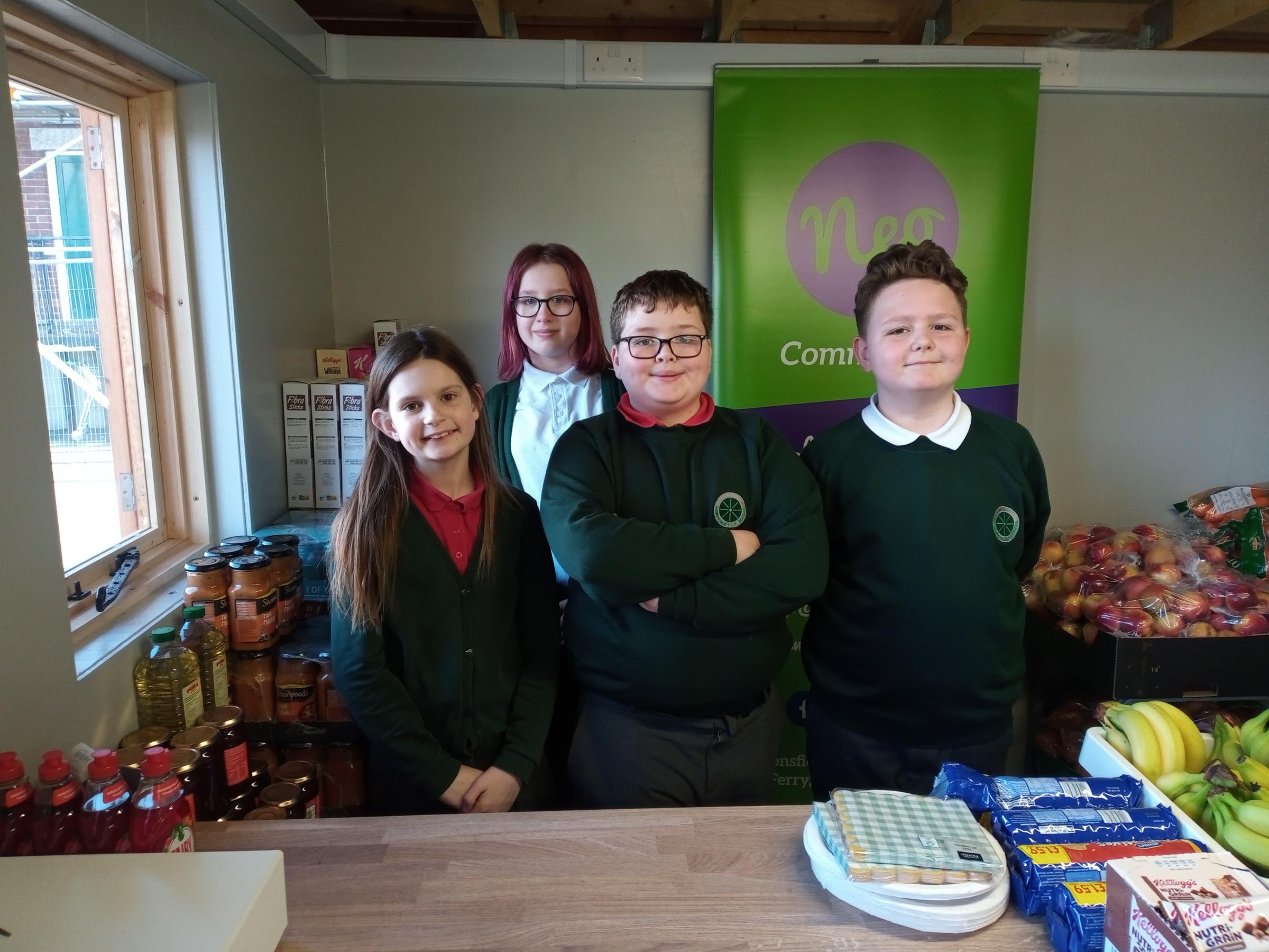 Working in the Sandycroft CP School shop, are pupils Ruby Chaplin-Baker, Bethan Dykinas, Harri Griffiths and David Hughes-Warr.