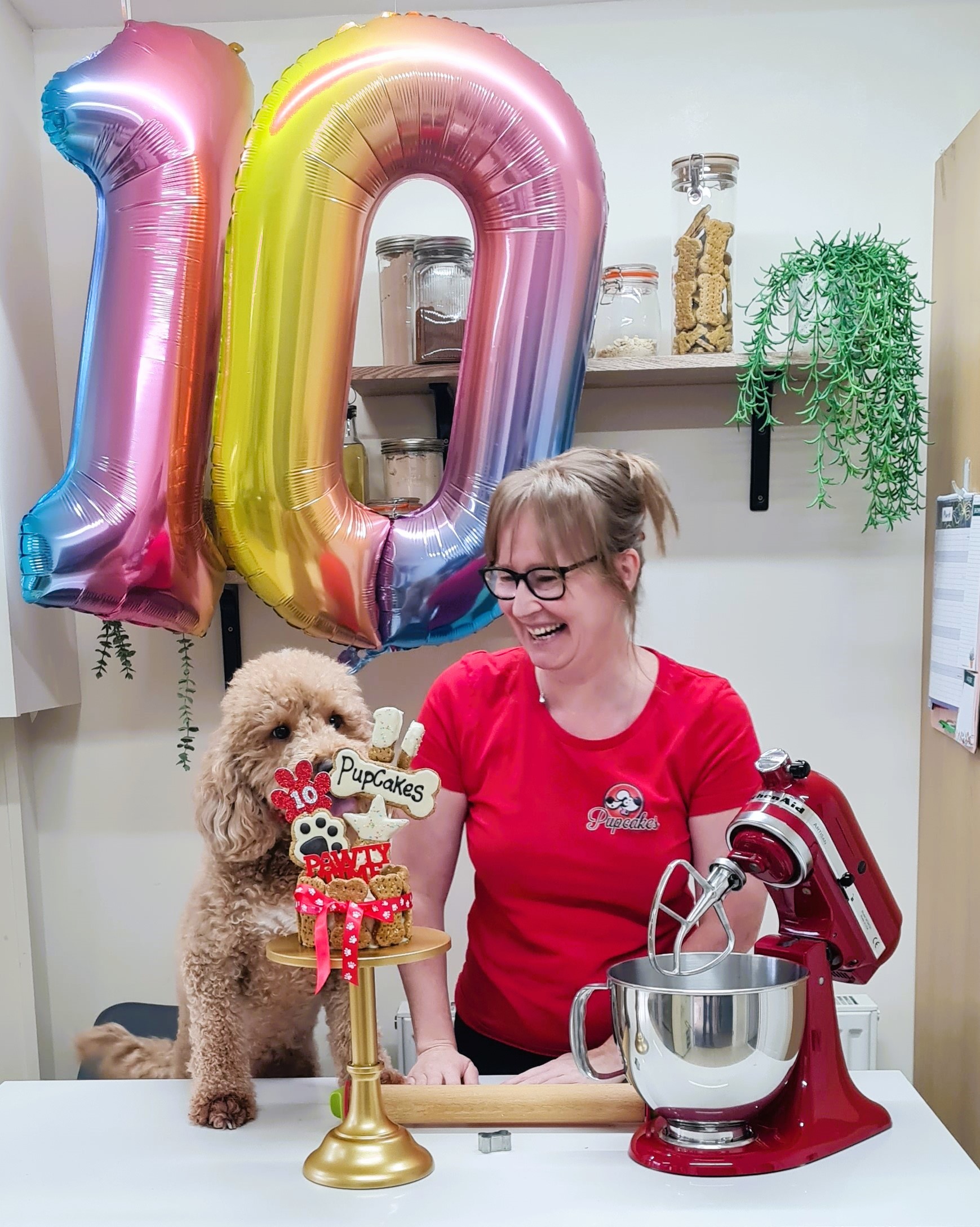 Owner of PupCakes Dog Bakery, Sharon Parry, celebrates the business 10th anniversary with her own dog Bobbi.