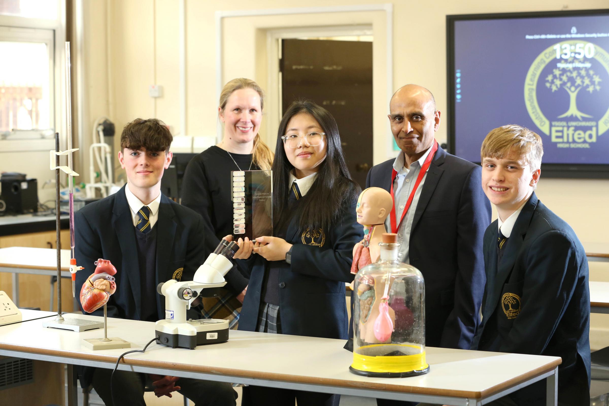 Synthite Science Prize winner Kimmy Chen (centre) Elfed School, Buckley, with runners-up Fabio Franco (left) and Alex Earlam (right) seen here with Synthite director and commercial manager, Sana Niazi and Dr Claire Cornmell, science teacher at the school