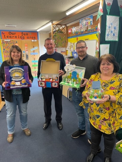Ysgol Heulfan governors with Easter competition entries.