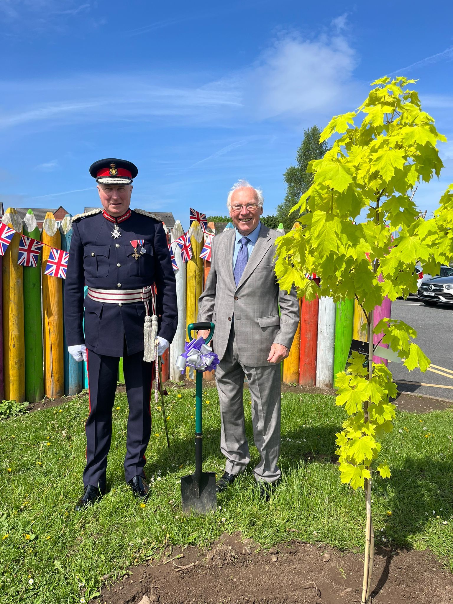 Lord Lt of Clwyd, Harry Fetherstonhaugh and chair of governors Edwin Hughes plant a commemorative tree.