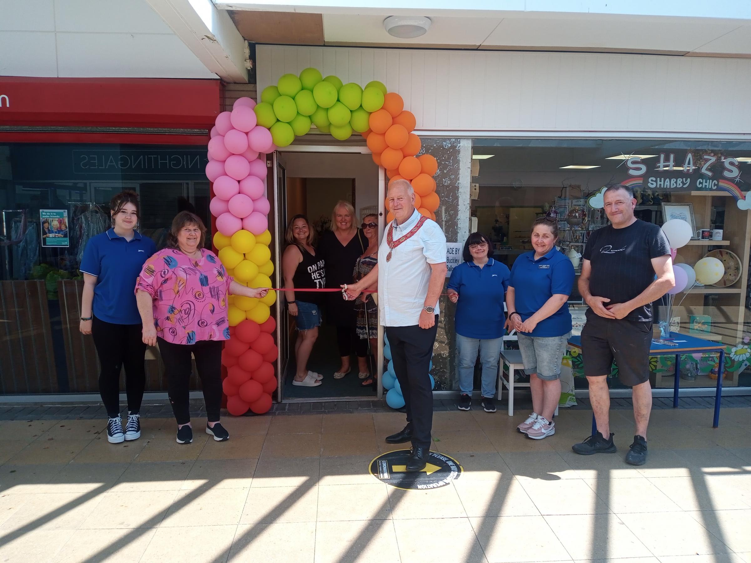 The new wellness centre is opened in Buckley Shopping Cenre, with, from left: Tegan Evans, Sharon Beck, Nicola Bythyn, Joanne Evans, Cllr Charles Cordery, Kay Rathbone, Cerys Walter and Martin Beck.