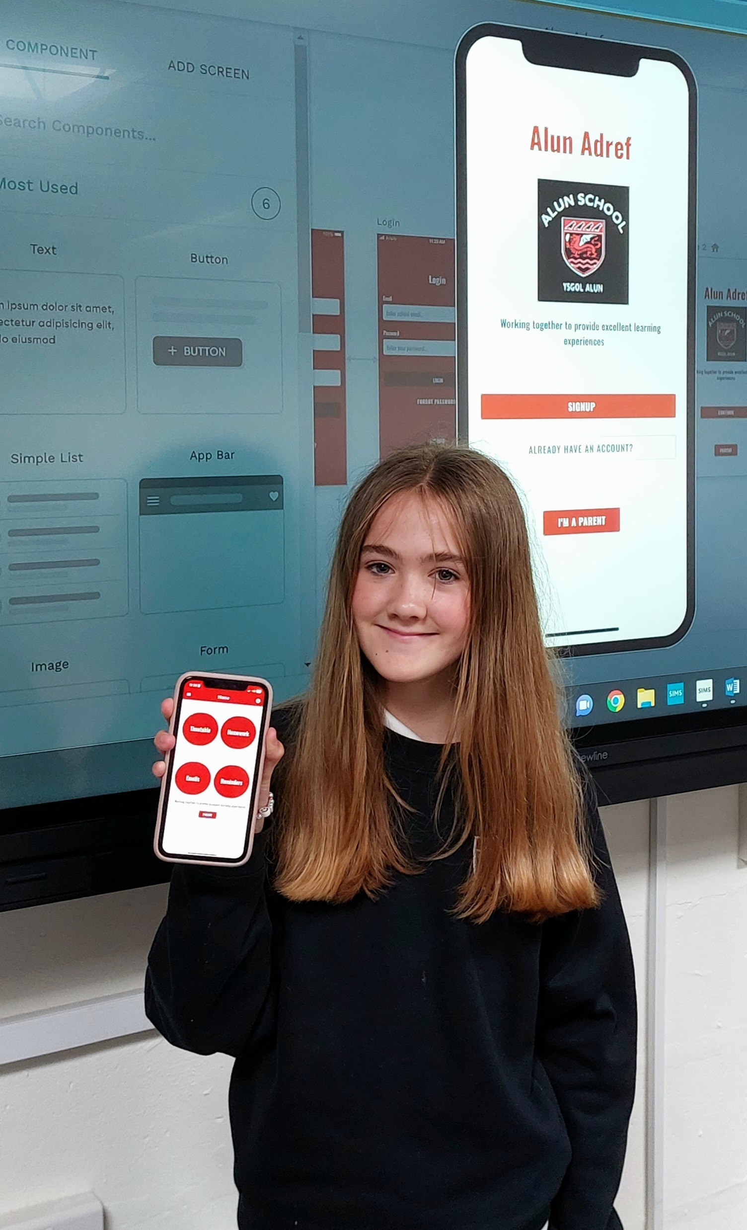 Elin Crickett demonstrating her app to students and teachers in school.