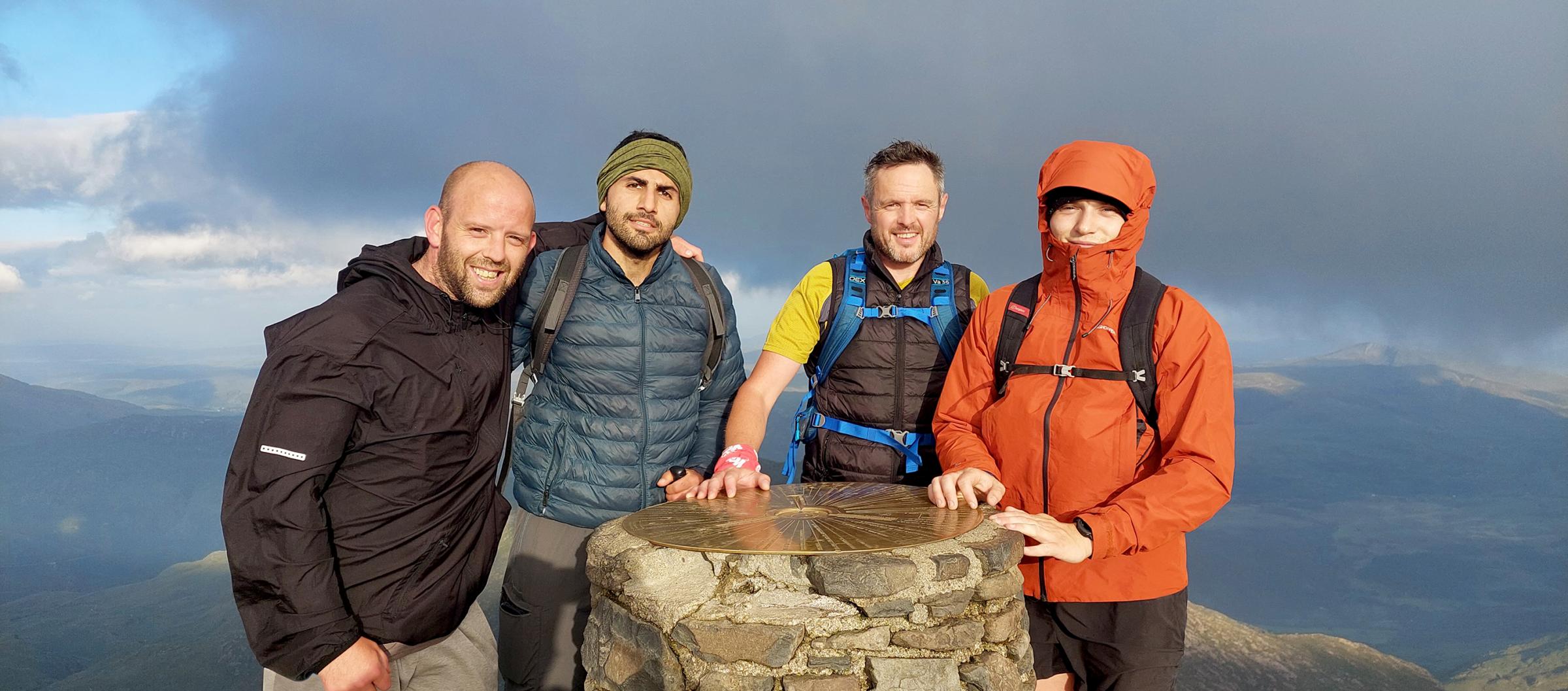 Steve Gibson, Reza Yaghoubi, Iwan Gwyn and Ben Morgan at the top of Yr Wyddfa.