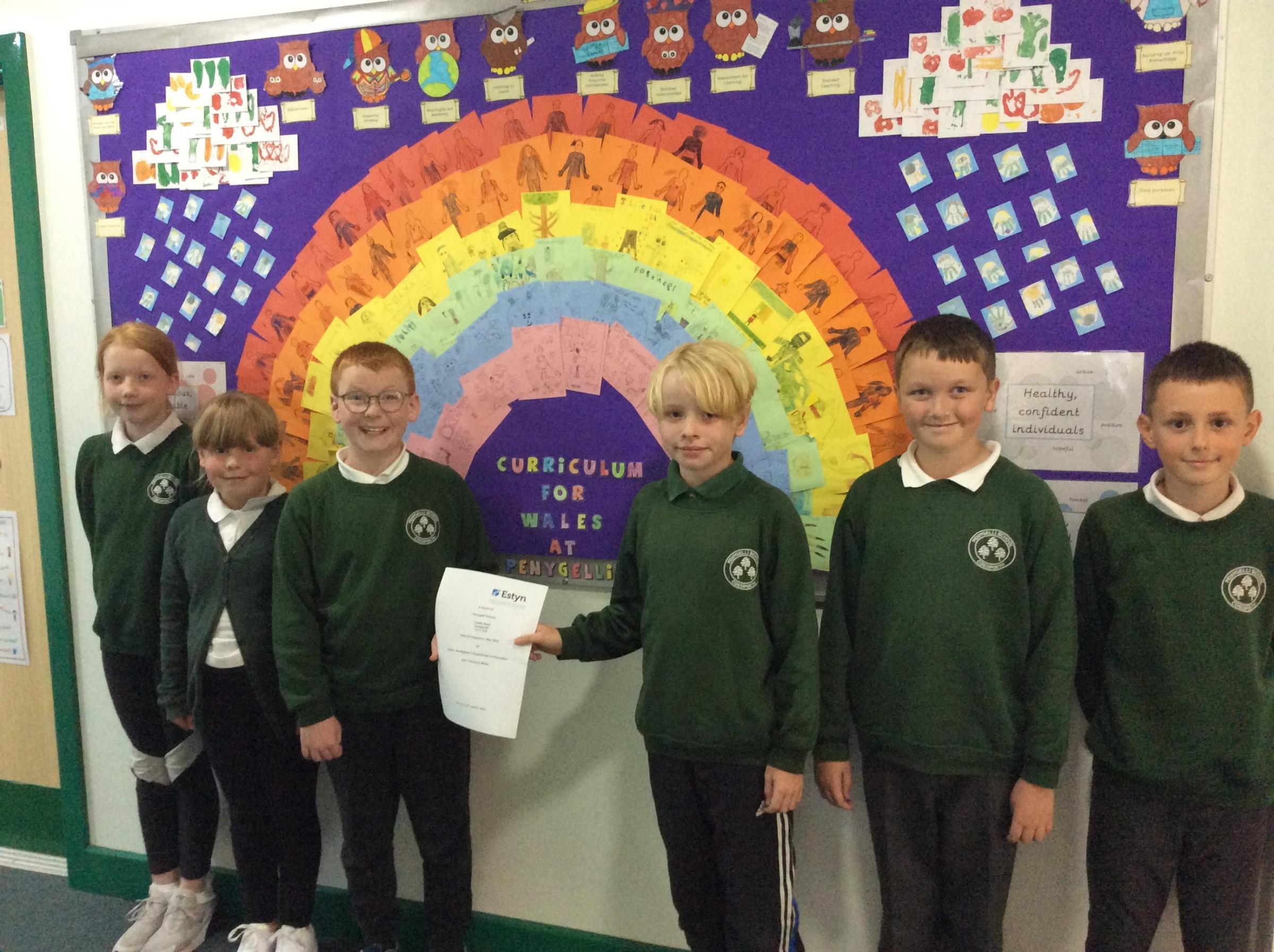  Ysgol Penygelli pupils with the schools recent report.