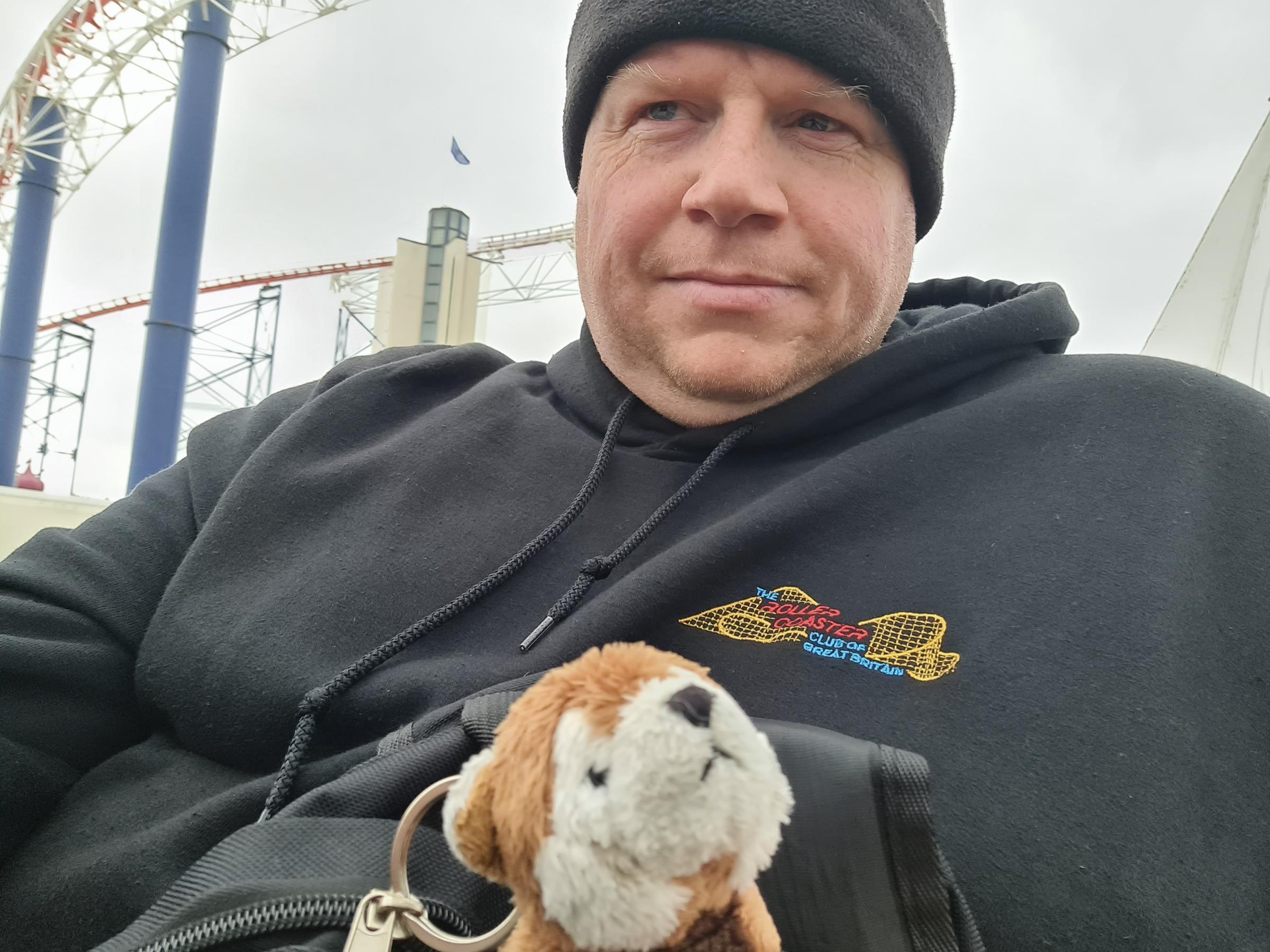 Andrew Bond with RP, his red panda travelling companion which goes everywhere on his travels, attached to his backpack/camera bag.