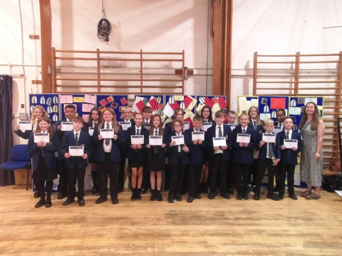 New Year 7 students at Ysgol Rhiwabon, with their SWAN certificates.
