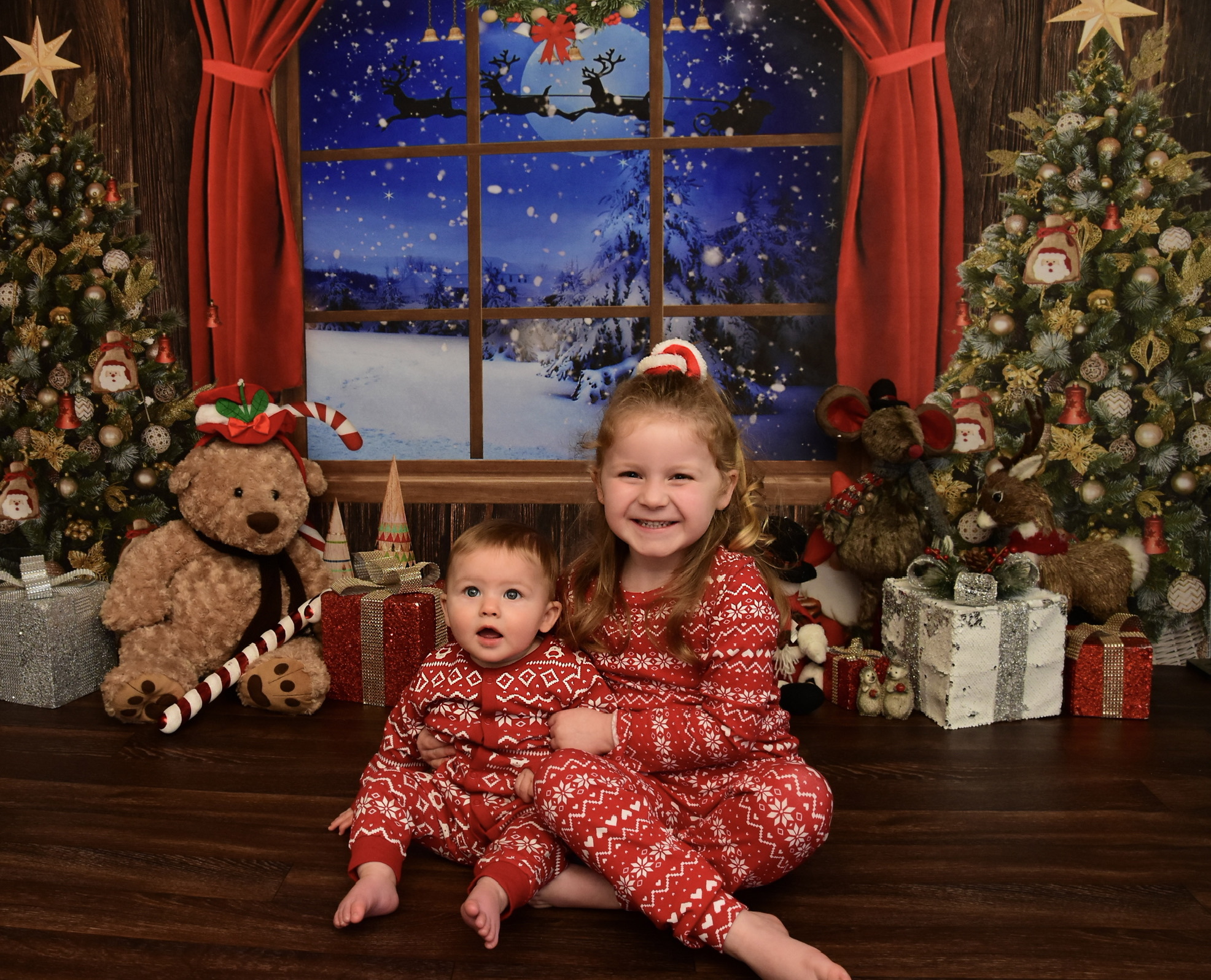 Lauren Jones, from Wrexham: Eight-month-old Teddy Vaughan Thomas Hughes first Christmas photo shoot with his big sister Grace Olivia. Photo by Claire Felgate-Davies.