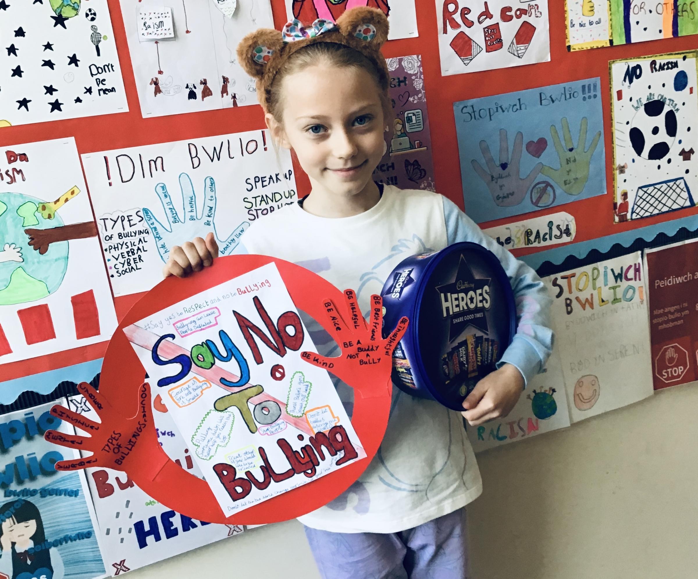 Sofia and her winning Anti-Bullying Week poster.