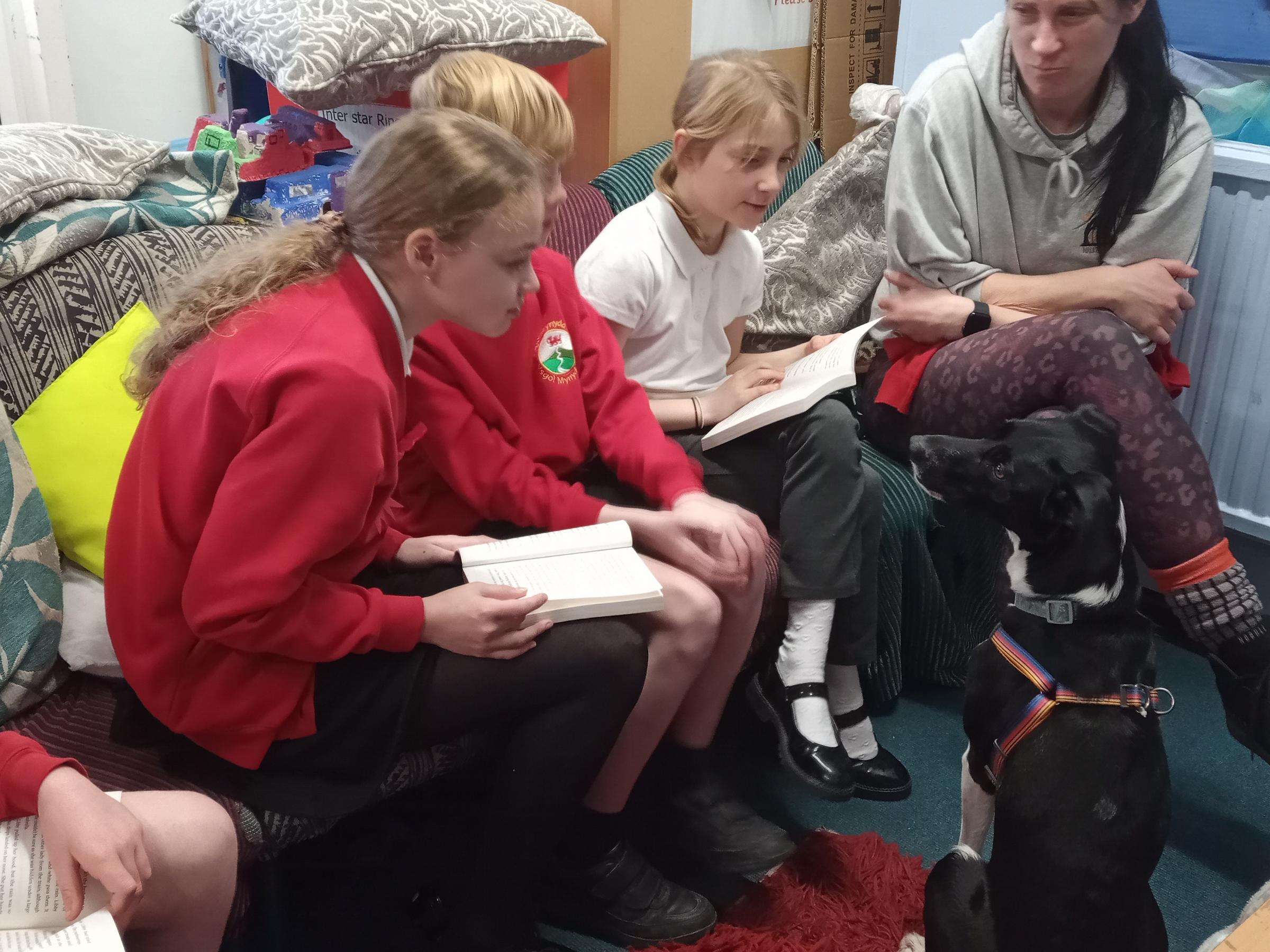 Reading aloud with Penny, and Jenny Sullivan, during a session at Ysgol Mynydd Isa.