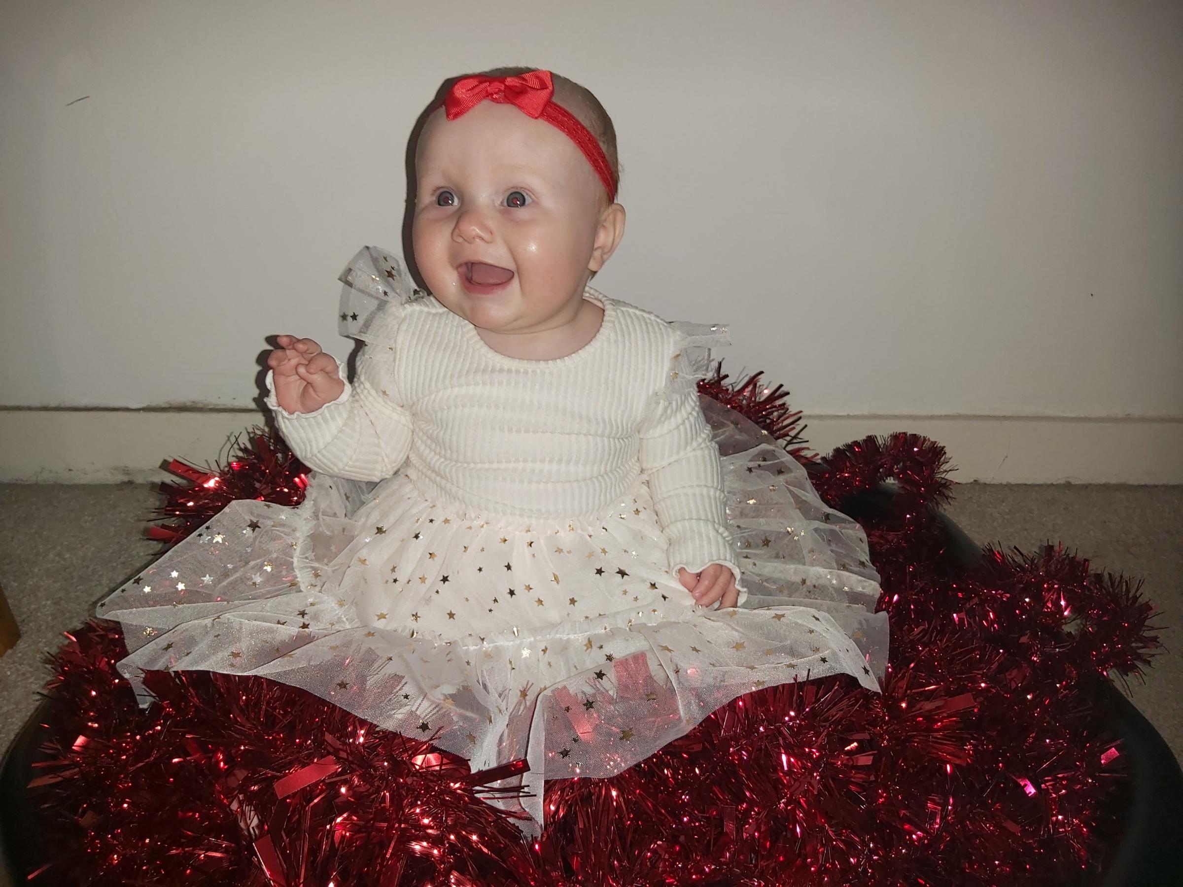 Chelsea Taylor, from Buckley: Eight-month-old Aria Taylor having fun playing with tinsel in her sparkly party dress.
