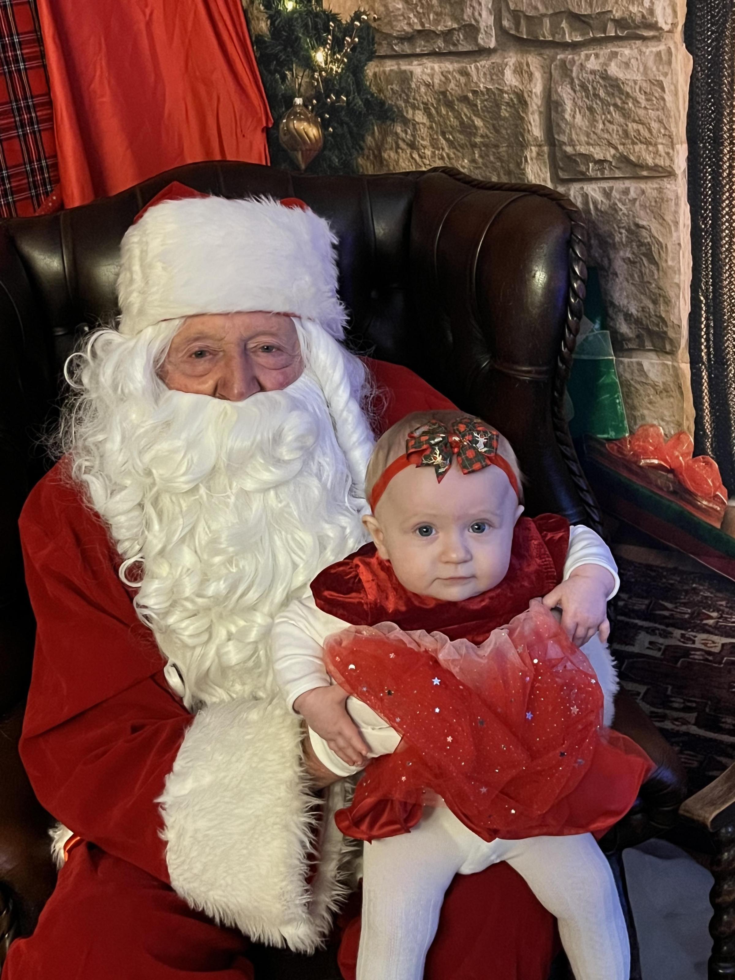Ashley Cousins, from Wrexham: Eight-month-old Alena and Santa.